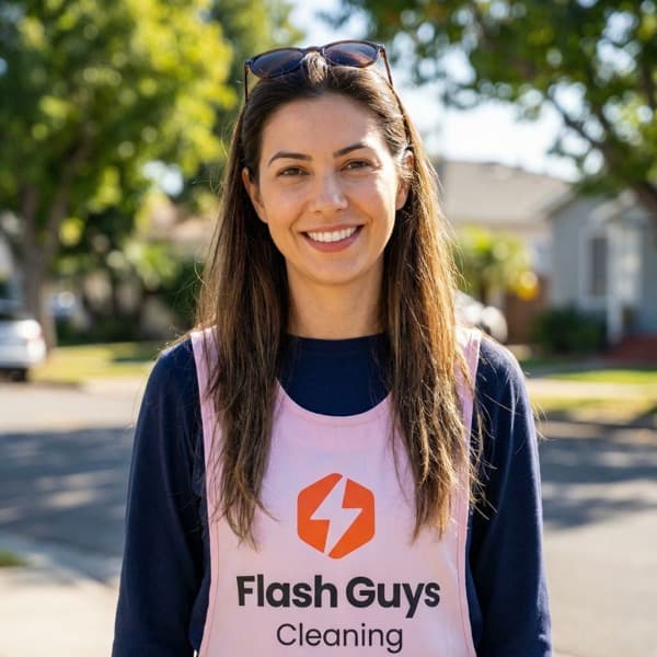 Camila, professional cleaner at Flash Guys Cleaning, in uniform outdoors