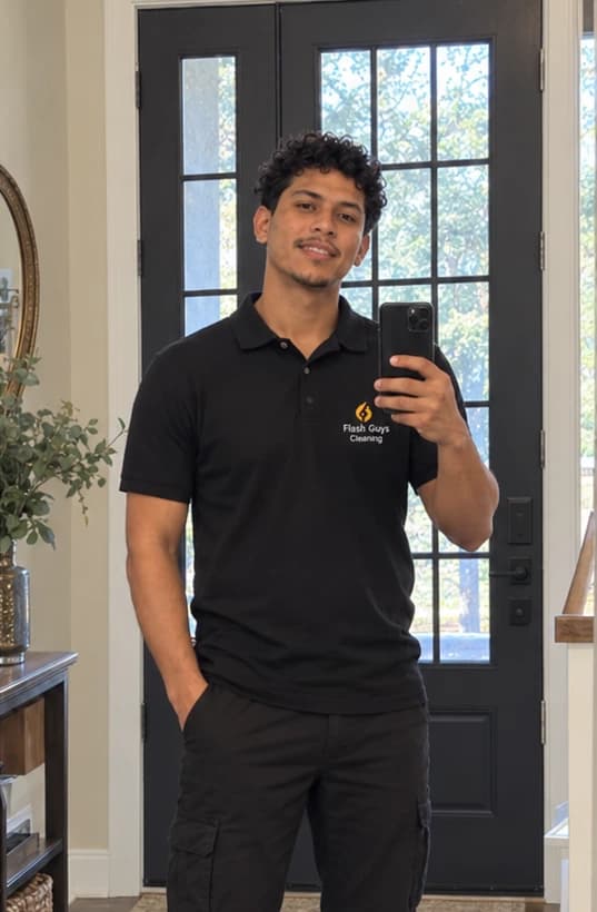 Carlos, professional cleaner at Flash Guys Cleaning, wearing the company cap