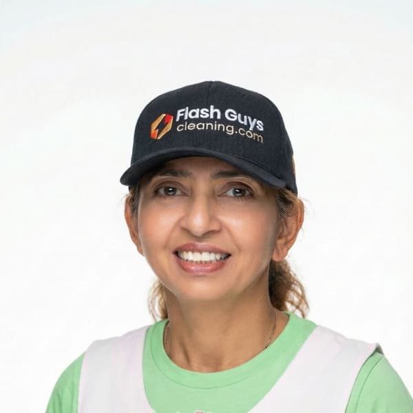 Maria, professional cleaner at Flash Guys Cleaning, wearing the company cap