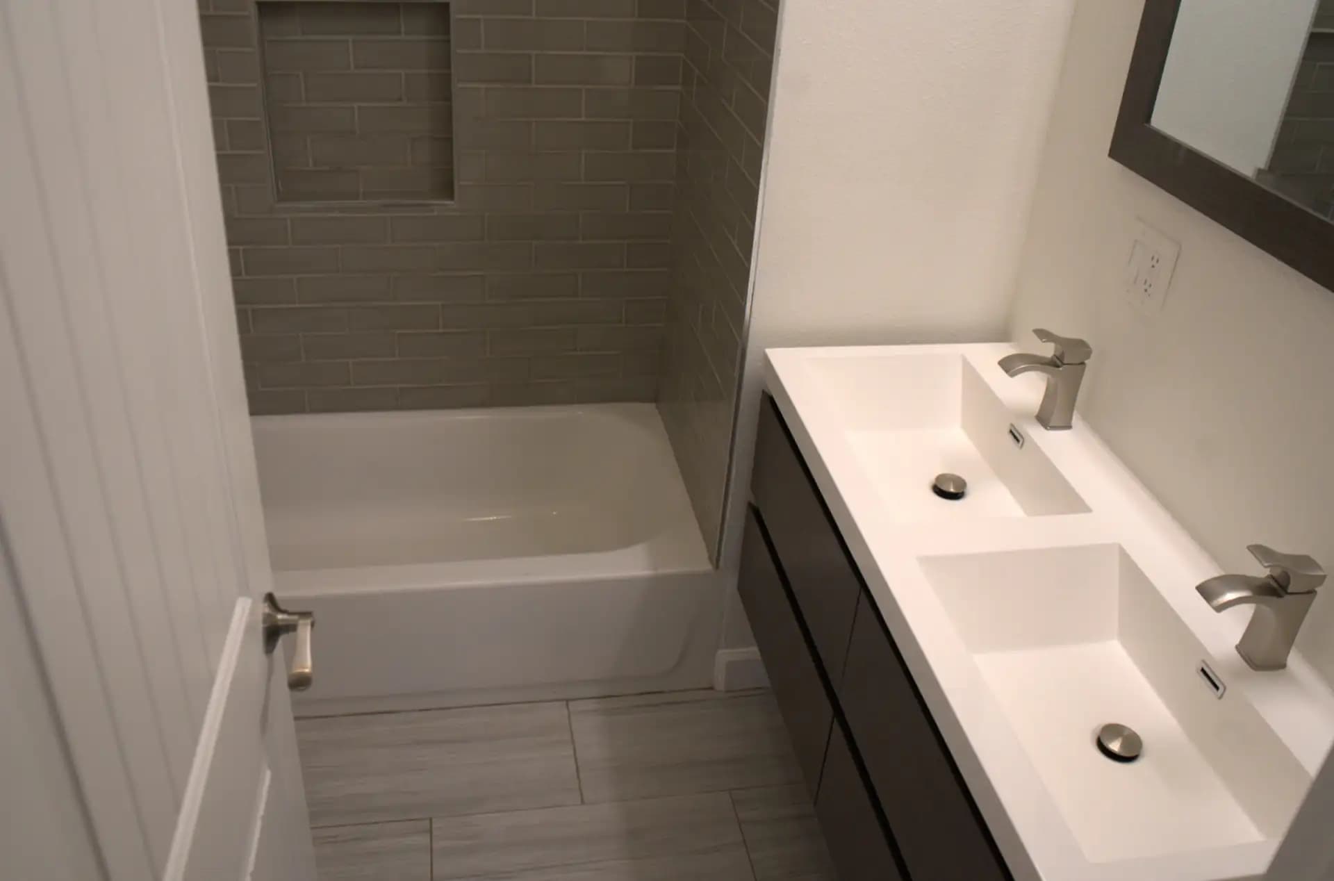 Modern bathroom with double sink and spotless tub after professional cleaning in Los Angeles.