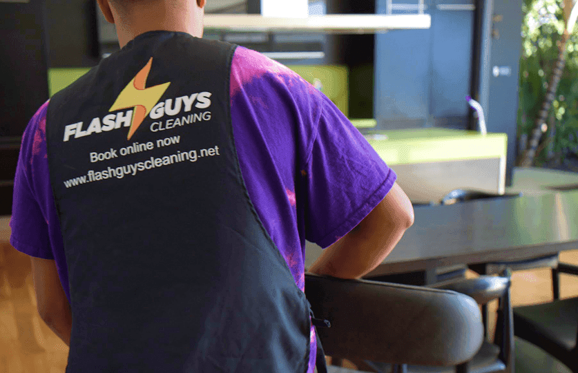 Flash Guys Cleaning professional wearing the company uniform
