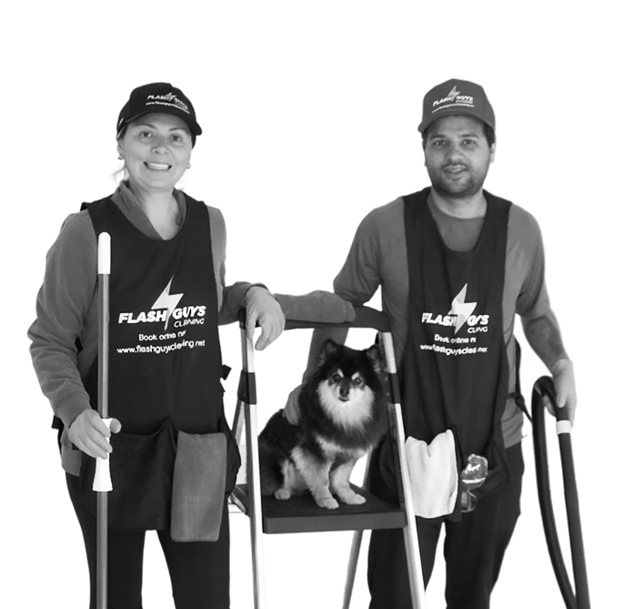 Flash Guys Cleaning founders smiling in uniform, posing with a fluffy dog and cleaning tools.