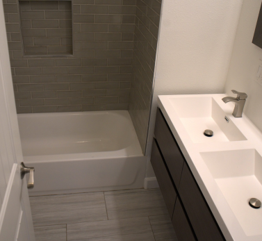Modern bathroom with double sink and spotless tub after professional cleaning in Los Angeles.